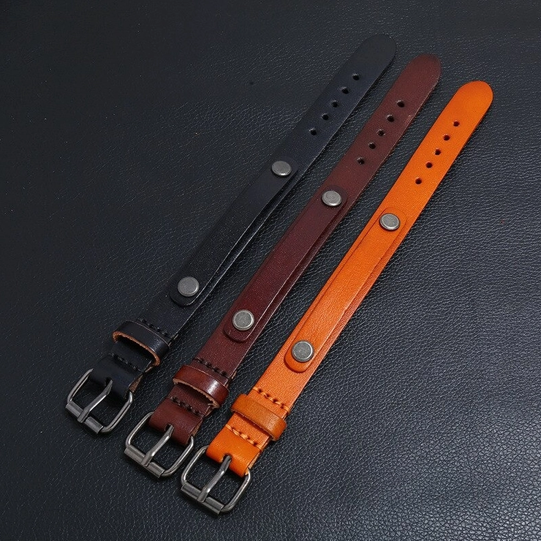 Three-piece genuine leather gothic bracelet set in black, dark brown, and tan showing antique silver rivets and buckles
