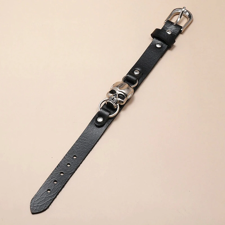 Adjustable gothic skull leather bracelet showing multiple sizing holes and unworn strap design