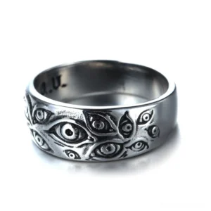 Vintage punk carved eye band ring - front facing view displaying full circle of engraved all-seeing eye patterns