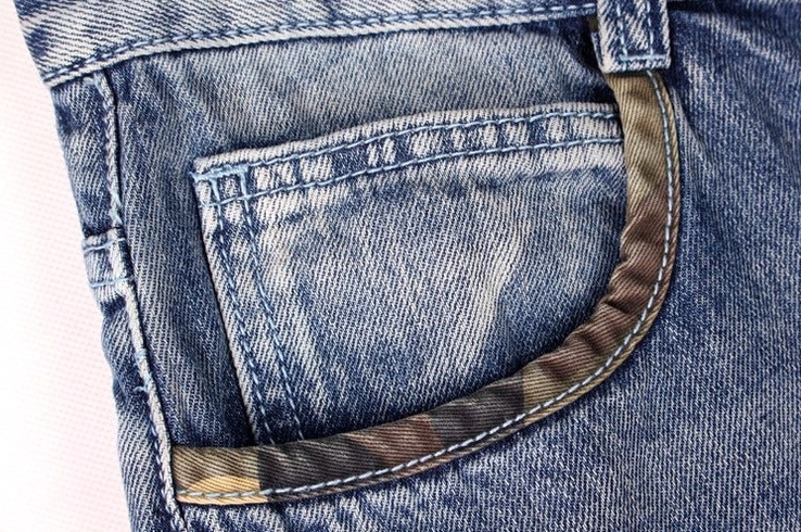 Men's loose baggy denim cargo capris styling detail - alternative streetwear piece side pockets