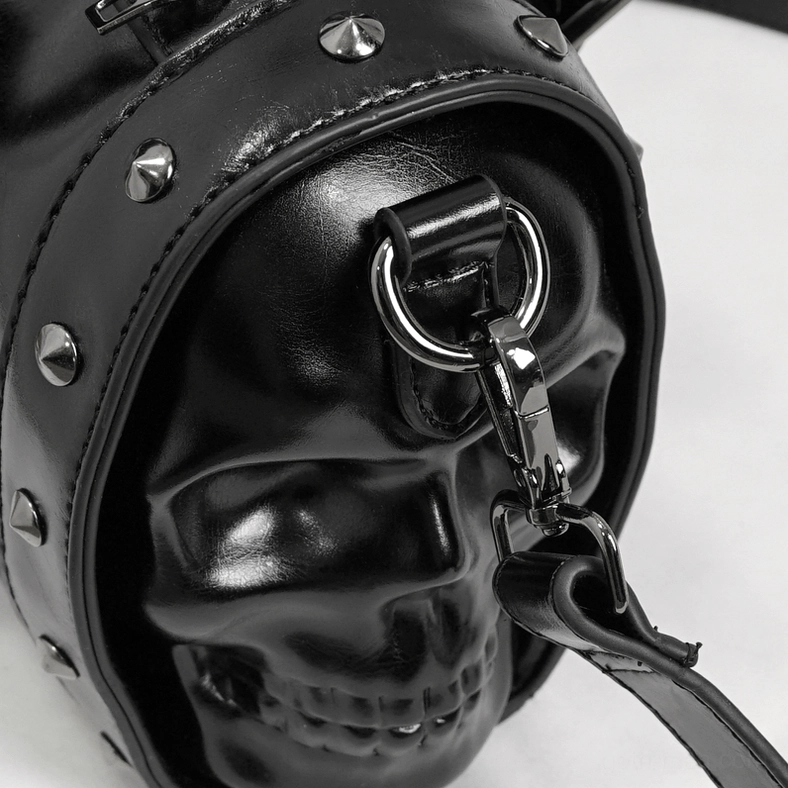 Goth alternative fashion handbag with skull design and metal rivet accents, structural shape display