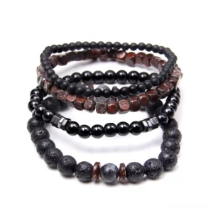 Dark aesthetic beaded bracelet collection featuring lava stone, wooden and metal spacer beads - layered arrangement display
