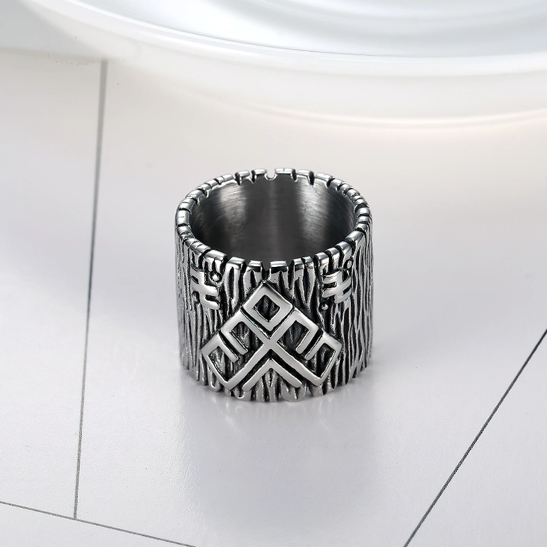 Top-down view of Viking rune ring showing polished inner band and geometric rune engravings on geometric patterned surface