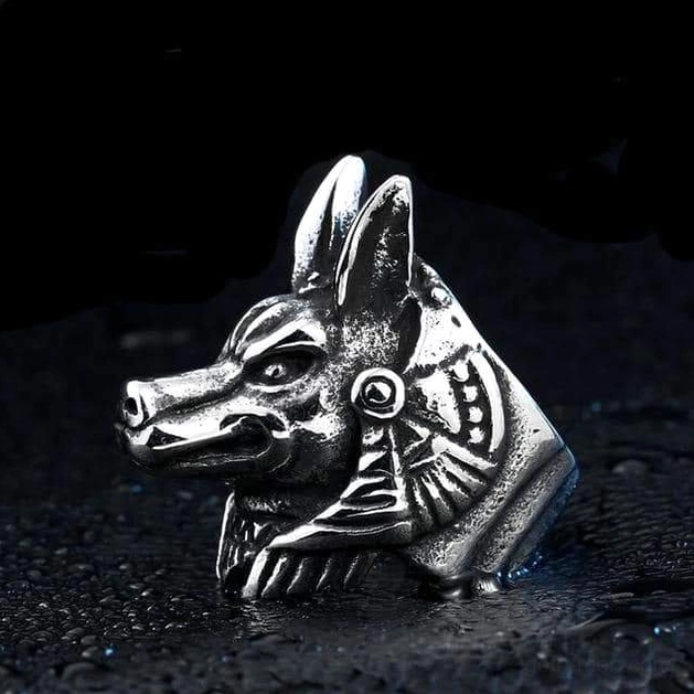 Anubis-inspired wolf head ring with Egyptian hieroglyphic details, antique silver, oblique side view on black leather