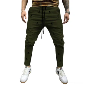 Army green all-over skull printed lace-up pencil trousers for men, demonstrating gothic aesthetic slim fit silhouette