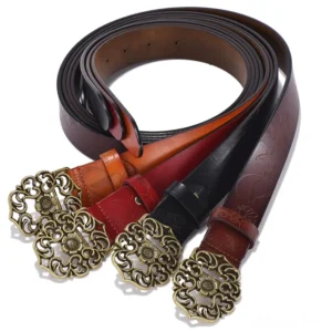 Set of assorted embossed leather gothic belts in multiple colors with antique bronze carved flower buckles, top-down flat lay