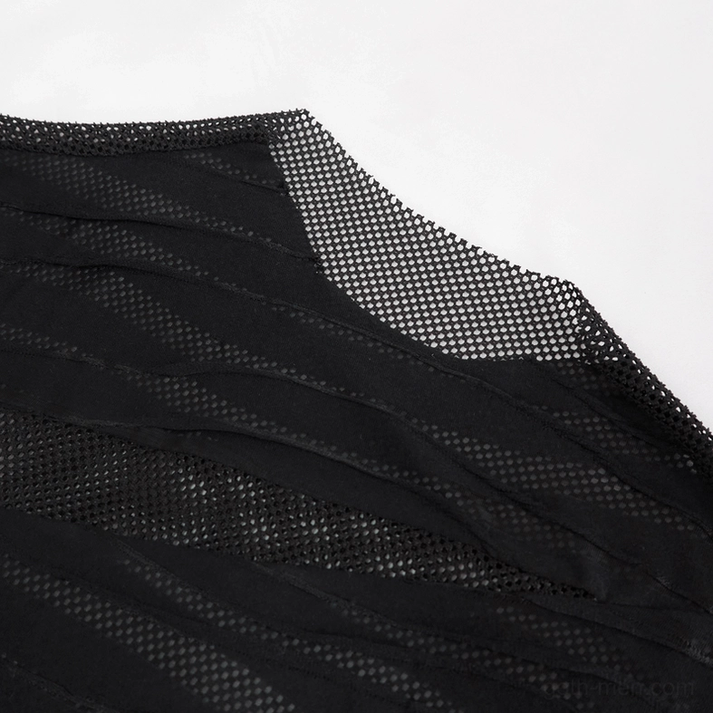 Close-up detail of asymmetric cut black stripes overlaid on see-through mesh fabric base
