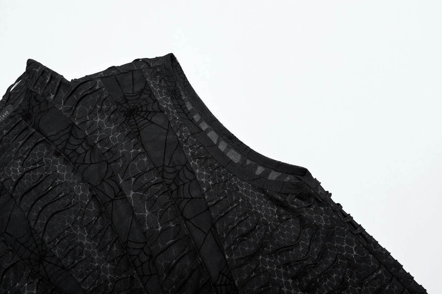 Asymmetric mesh gothic tank top fabric close-up - sheer distressed black texture detail