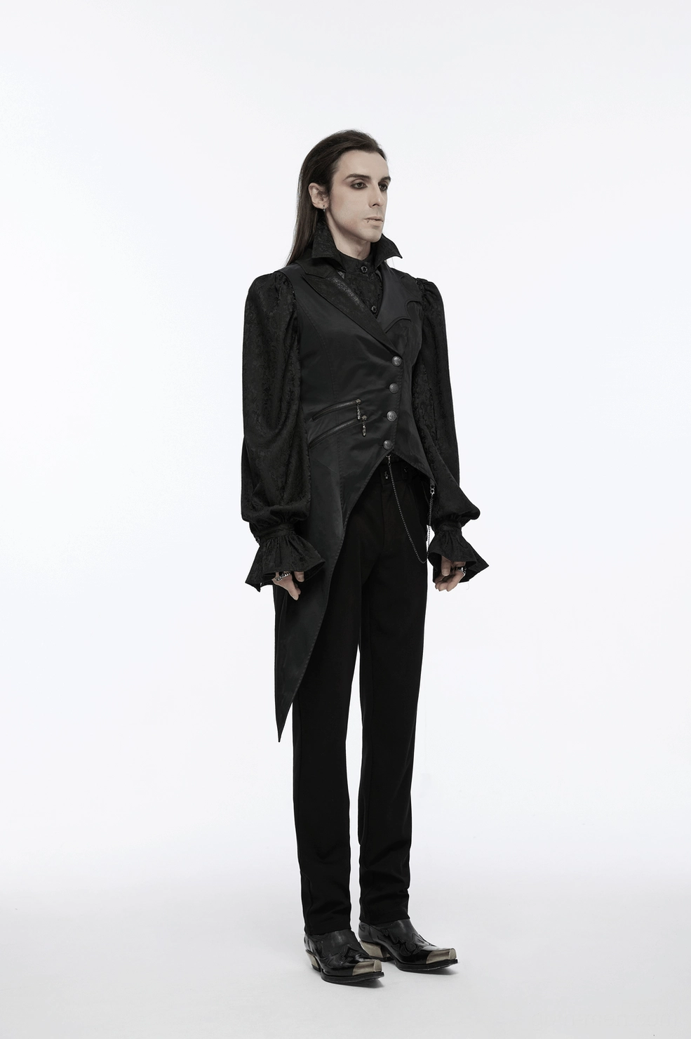 Full body styling shot of asymmetric black gothic waistcoat with metal chain accessories on male model, alternative fashion context