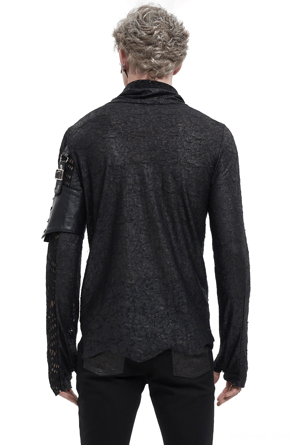 Rear view of asymmetrical gothic mesh top showing leather arm strap, irregular hemline, and crinkled knit fabric texture