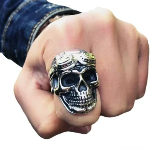 aviator skull ring on hand wearing denim sleeve casual streetwear styling