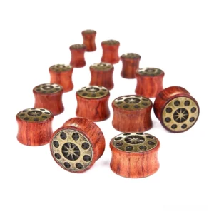 Natural bamboo wood tunnel gauges showcasing geometric starburst pattern and warm wood grain detail