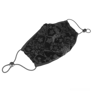 Black baroque gothic face mask with embossed floral pattern, flat lay view showing adjustable elastic buckle strap