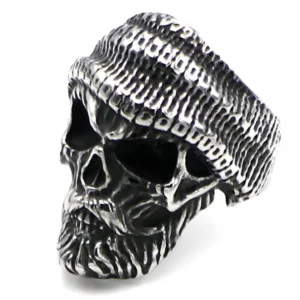 Bearded skull beanie ring with carved facial hair and knitted hat texture, left three-quarter profile view showcasing gothic alternative jewelry design
