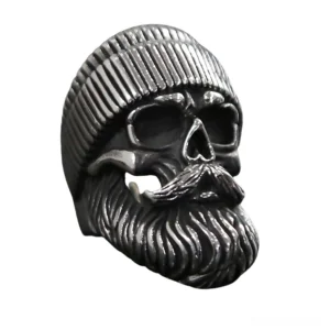 Gothic bearded skull rider ring right three-quarter angle displaying carved knit hat texture and hollow skull eye sockets in antique dark metal finish