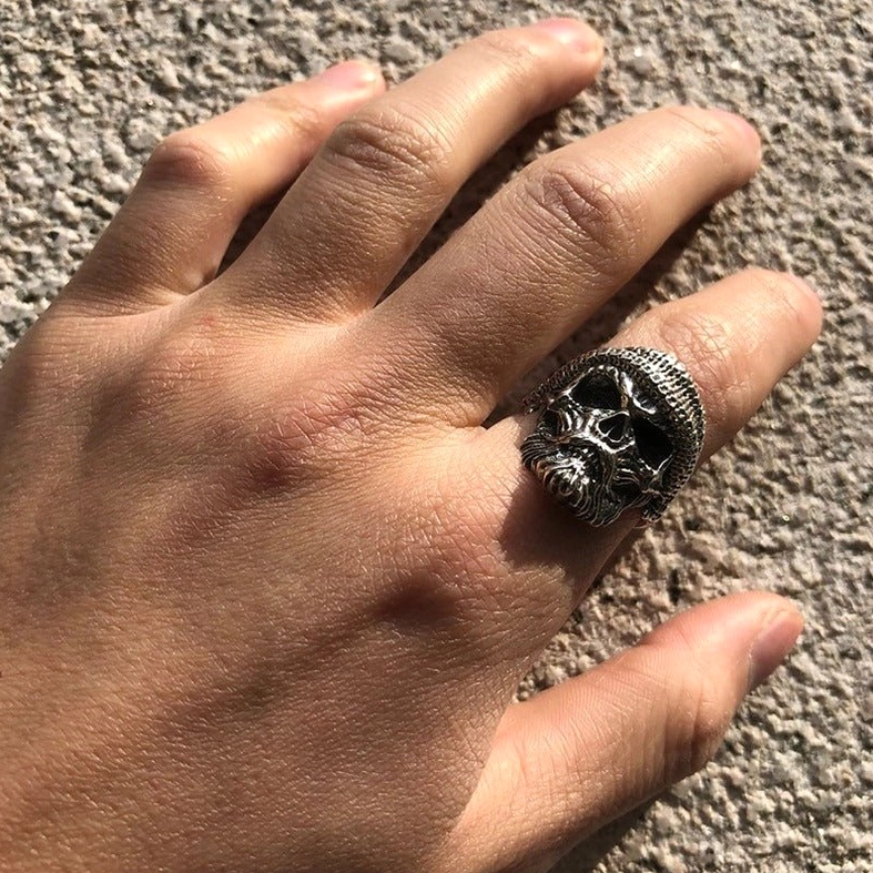 Gothic bearded skull ring on pinky finger – side view demonstrating wearability and carved detail visibility