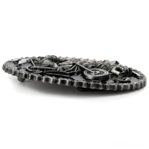 Side profile view of vintage belt buckle showing 3D embossed texture and rear belt fastener mechanism for gothic biker style