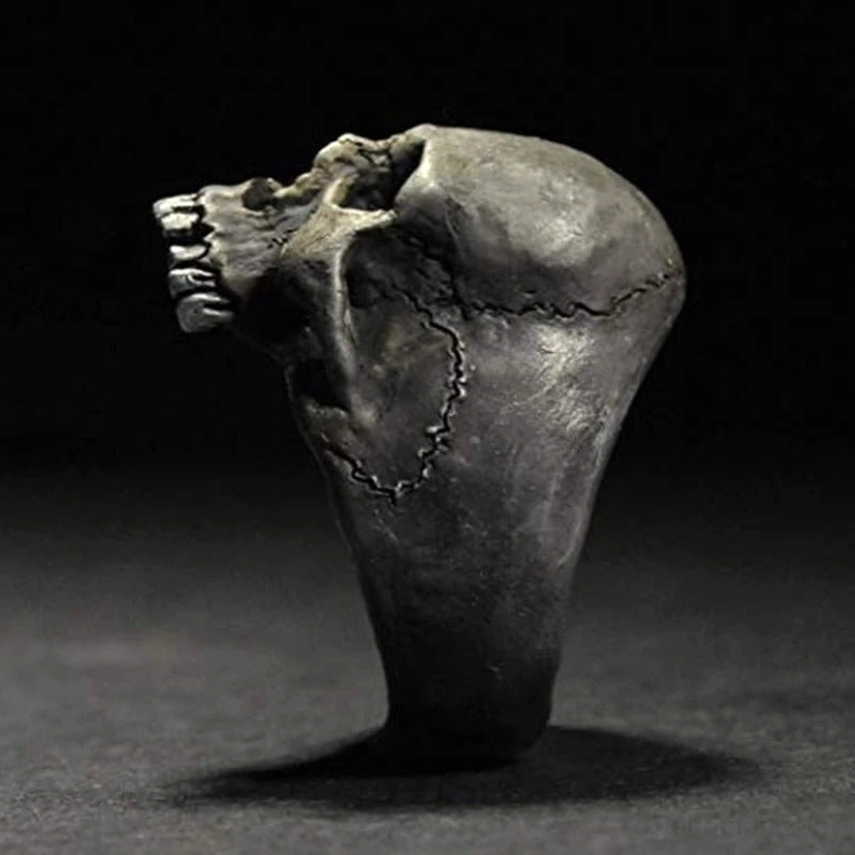 Biker skull ring side seam texture close-up showing worn silver metal finish and craftsmanship