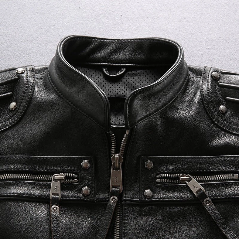 Motorcycle vest collar and metal hardware close-up with perforated lining