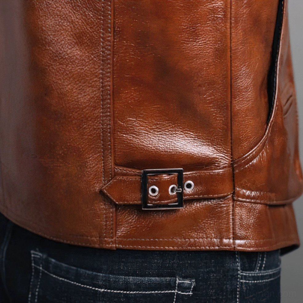 Detail shot of brown leather vest waist adjustment buckle and precise stitching on back section