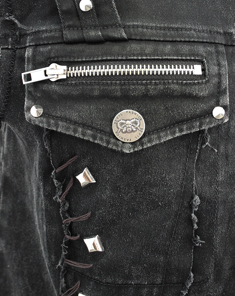 Alternative style black denim vest showing pocket placement and studded construction details