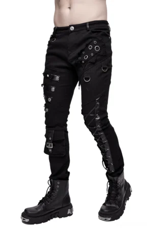 Men's black asymmetric gothic pants with lacing and metal studs, front side view on model with combat boots