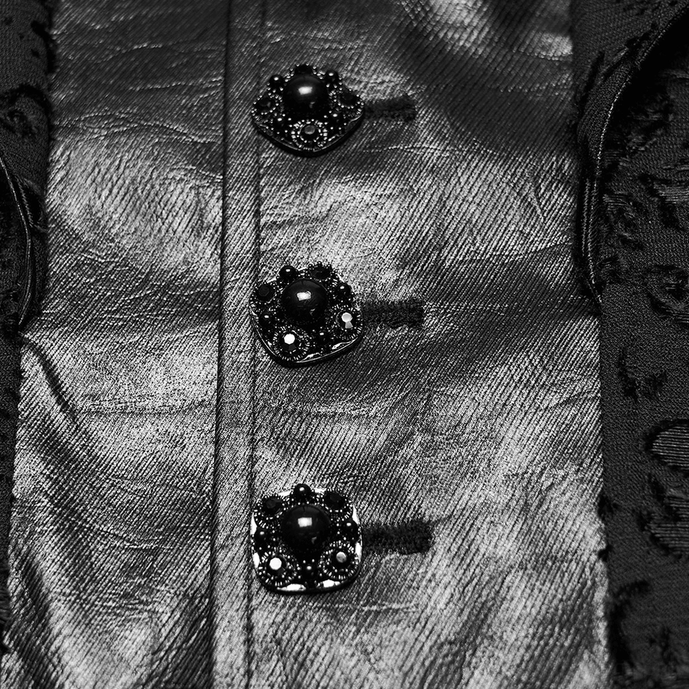 Black baroque waistcoat button close-up showing ornate metal buttons with black gem accents on faux leather fabric