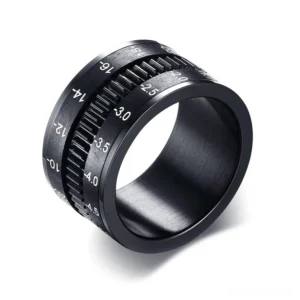 Black stainless steel camera lens spinner ring front view with focal length markings and geometric design