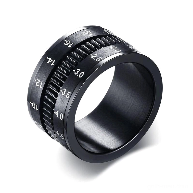 Black stainless steel camera lens spinner ring front view with focal length markings and geometric design