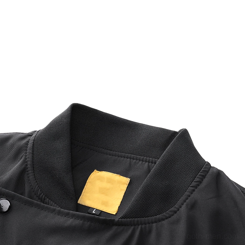 Close-up of black cargo bomber jacket ribbed mandarin collar with metal snap buttons and inner tag