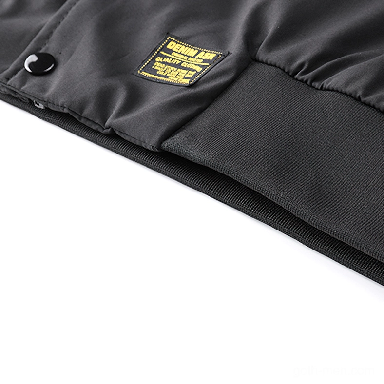 Black cargo bomber jacket front pocket and zipper system with metal hardware detail