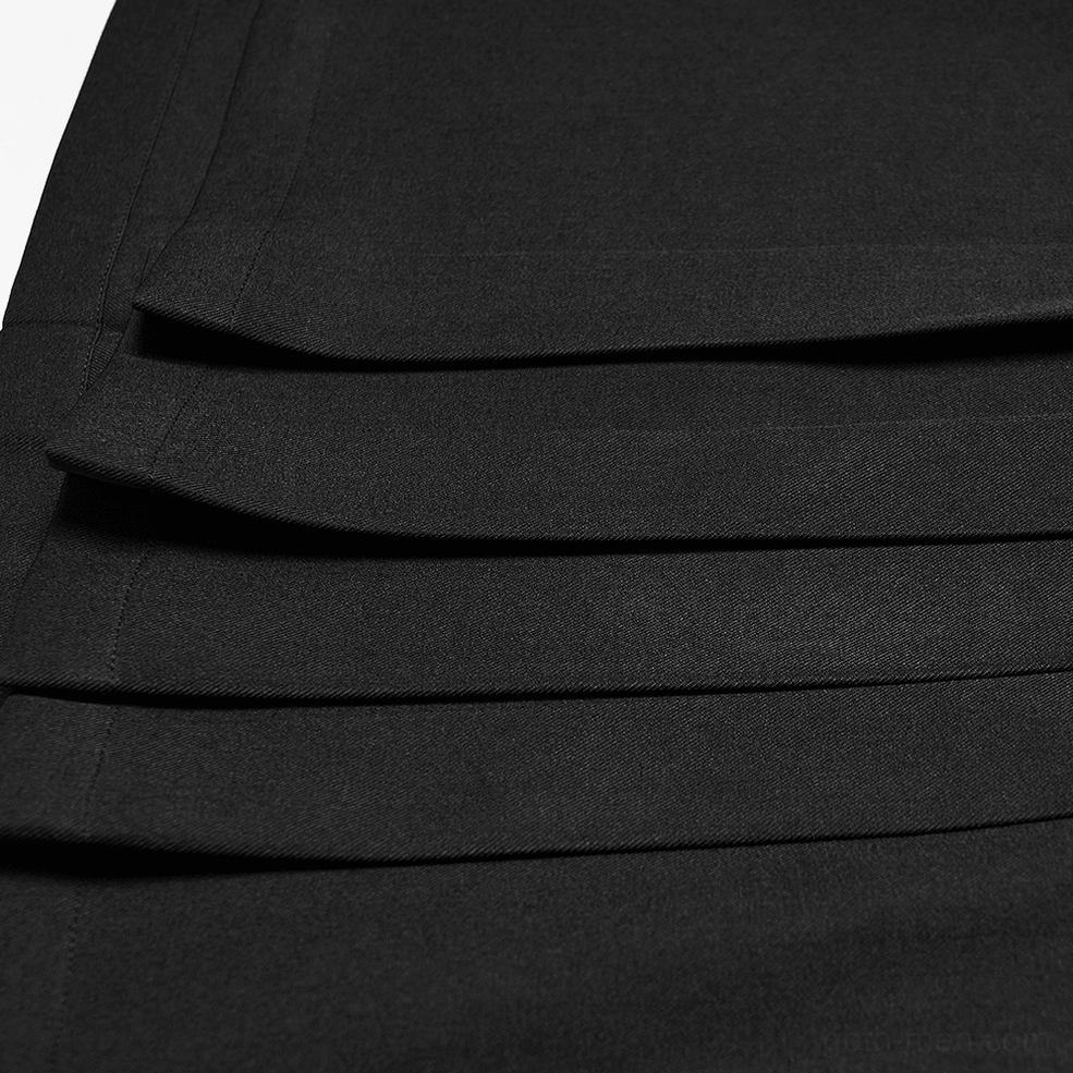 Black pleated cargo kilt texture and construction detail showing twill fabric weave and pleated panels