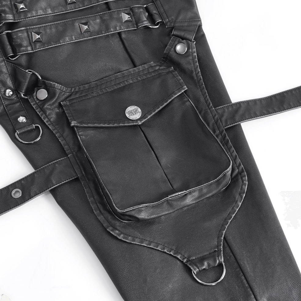 Close-up of black cargo pants flap pocket featuring metal button, D-ring hardware, and functional utility design