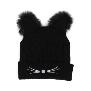 Flat lay top-down view of black ribbed knit cat ear beanie showing fuzzy faux fur ears and embroidered cat face details