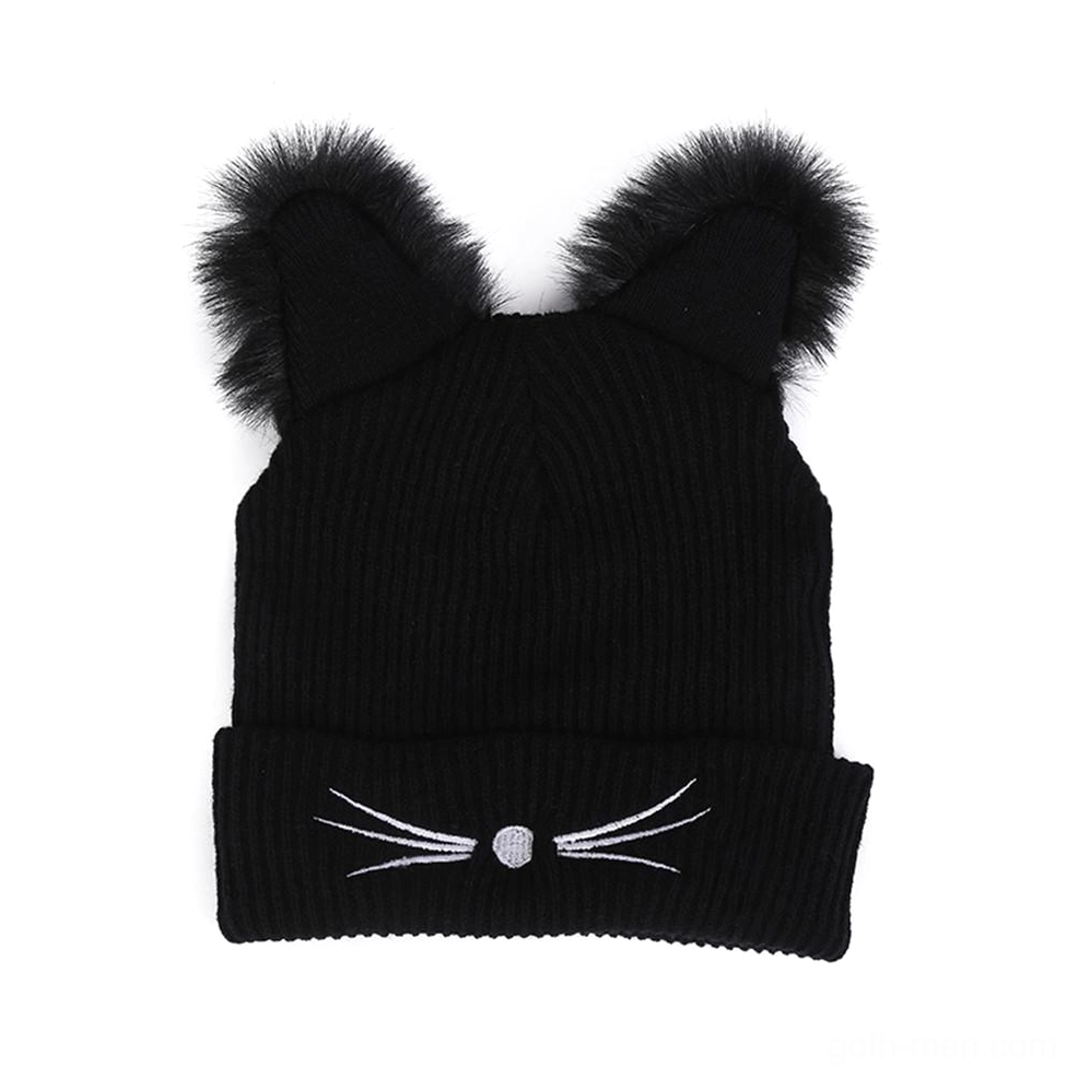 Flat lay top-down view of black ribbed knit cat ear beanie showing fuzzy faux fur ears and embroidered cat face details