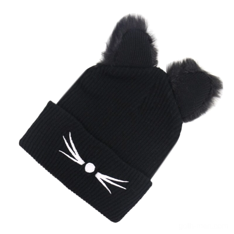 Side angled view of black cat ear knitted beanie with folded cuff and embroidered cat face alternative fashion