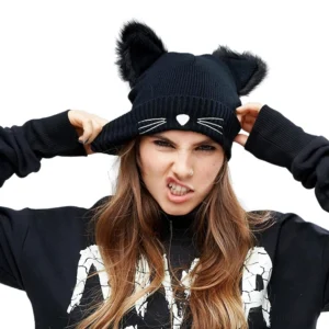 Black cat ear gothic beanie with embroidered whiskers and nose worn by model, front view alternative fashion winter hat