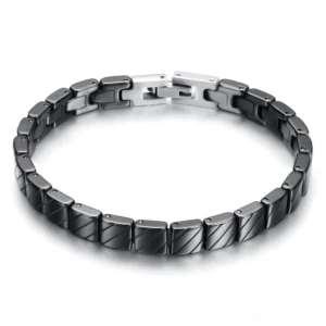 Black ceramic link gothic bracelet with engraved chevron pattern and silver toggle clasp, overhead studio view