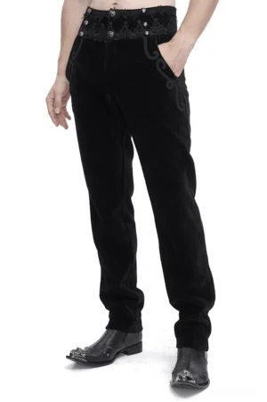 Black corduroy gothic pants with ornate lace waistband front three-quarter view on male model, studio photography