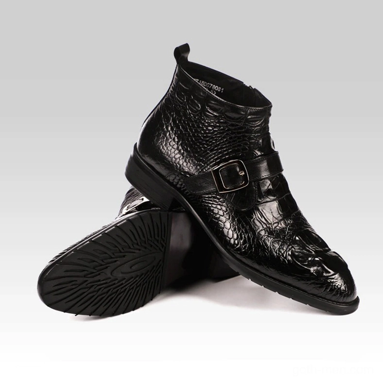 Pair of black crocodile leather gothic chelsea boots crossed display showing non-slip outsole