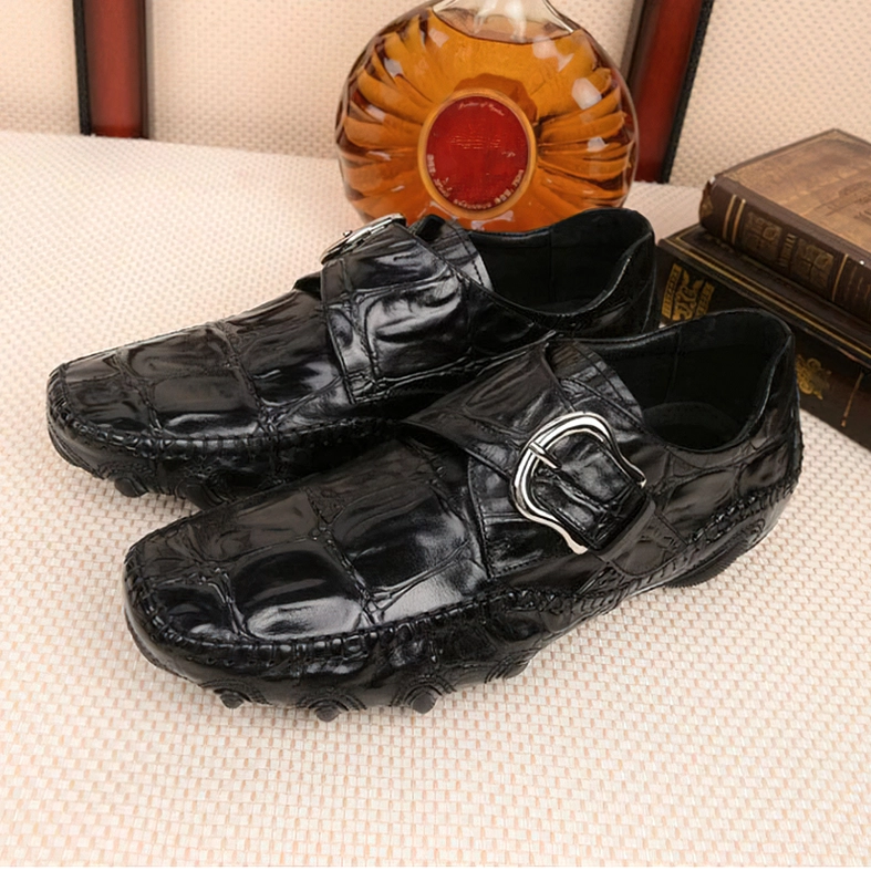 Black crocodile embossed gothic loafers detailed side profile view showcasing metal buckle accent