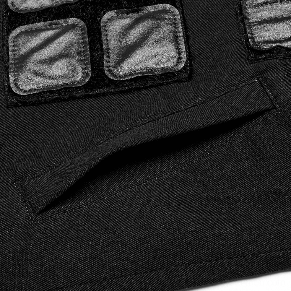 Detailed close-up of black denim tactical armor vest showing black fabric texture and sewn side pocket construction