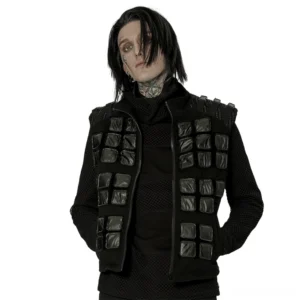Black denim tactical armor vest with studded shoulder pads and geometric padded patches, front view worn on male model