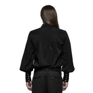 Back view of black gothic lace dress shirt displaying structured pleated yoke and decorative cuff button details, worn by long-haired male model
