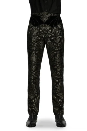 Black and gold jacquard velvet gothic pants front view on male model, showcasing intricate floral damask pattern and sculptural velvet waistband with metal buttons