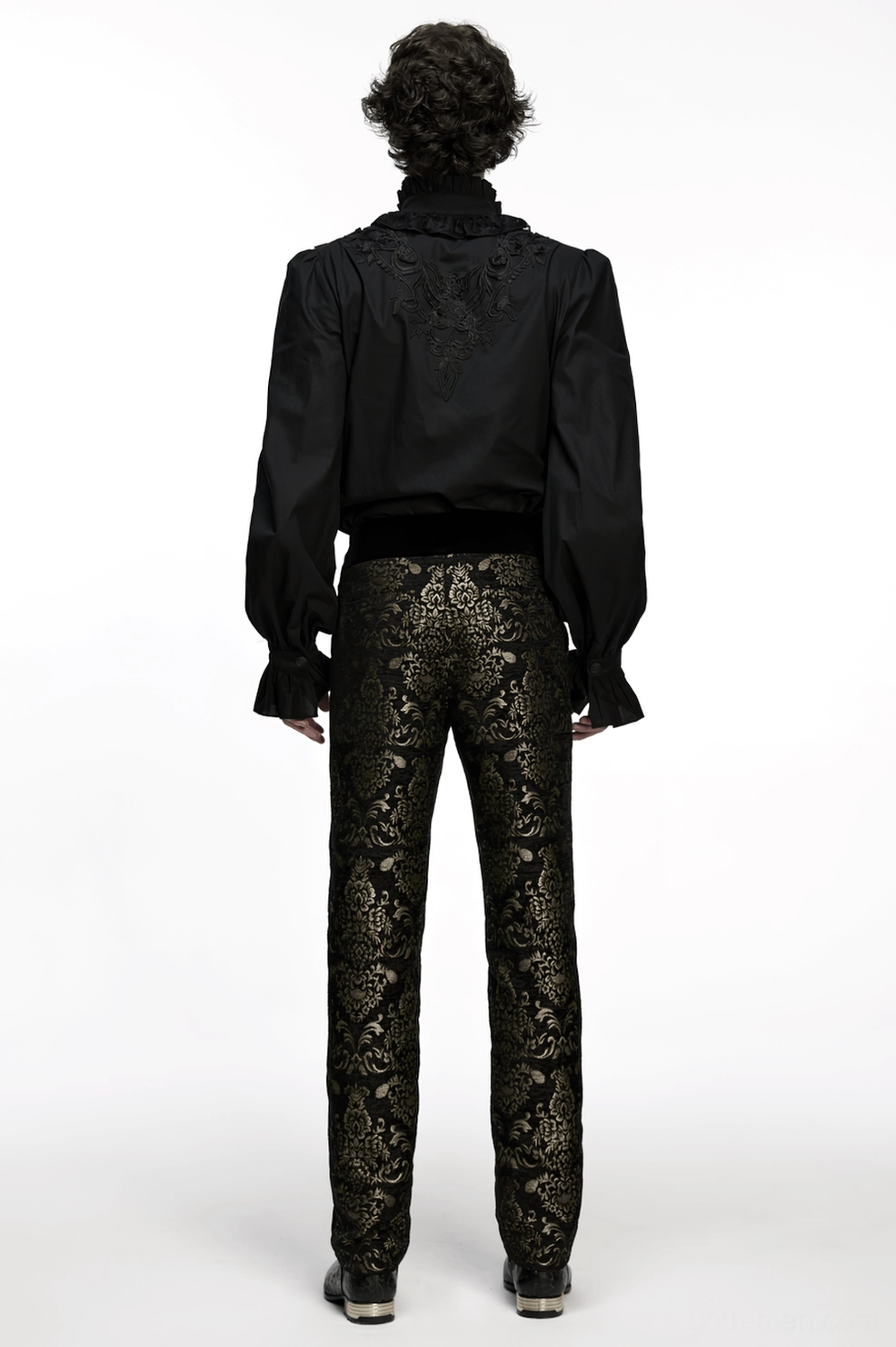 Draped view of black and gold jacquard gothic pants showing fabric movement and elegant hang of structured polyester construction