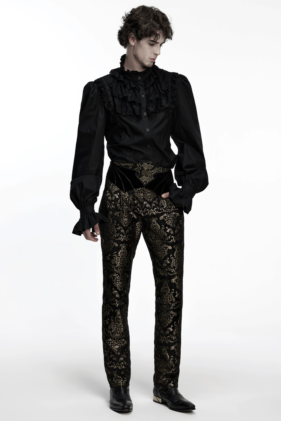 Product photography of black and gold jacquard gothic pants highlighting three-dimensional damask weave and architectural straight leg design
