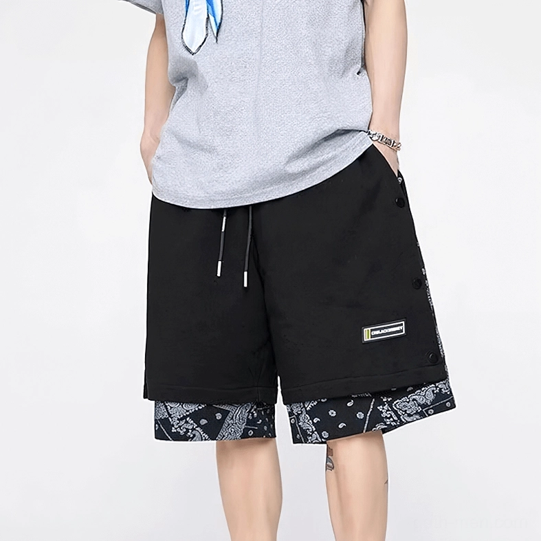 Gothic drawstring shorts in black with minimalist aesthetic and subtle ornamental details