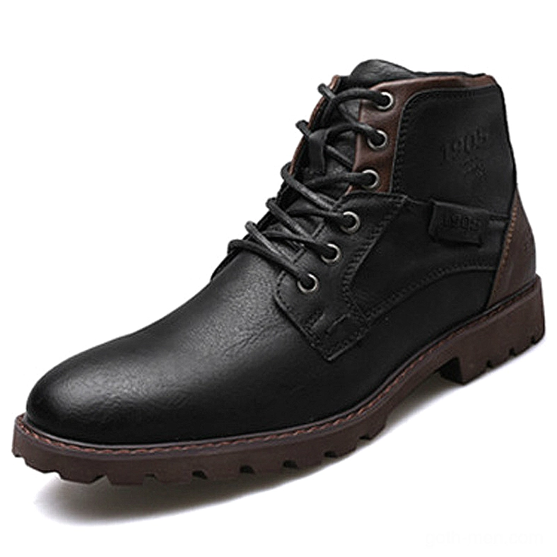 Black leather pointed-toe gothic ankle boot with vintage branding and rubber sole, side profile