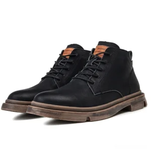 Pair view of black gothic lace-up leather ankle boots with matte finish and pull tab heel detail